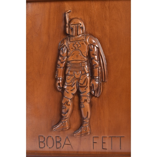 304 - Estate of Jeremy Bulloch - Star Wars - Artwork - a carved hardwood panel depicting Boba Fett to the ... 