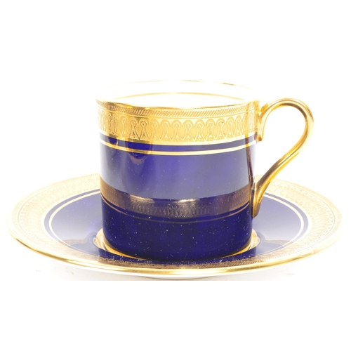 10 - A set of six Aynsley bone china coffee cups and saucers, with gold gilding scrollwork to cup edge an... 