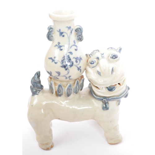 103 - A vintage 20th century ceramic pottery Asian Chinese figure of a Fu Dog with stem vase in blue and w... 