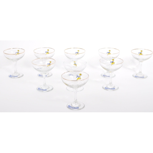 107 - An assortment of nine vintage 20th century circa. 1960's Babycham cocktail coupe glasses. Each with ... 