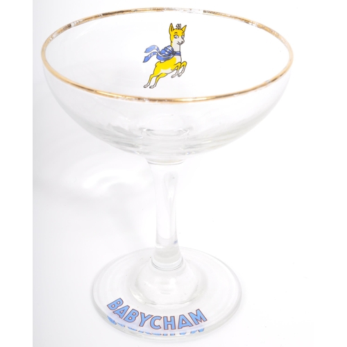 107 - An assortment of nine vintage 20th century circa. 1960's Babycham cocktail coupe glasses. Each with ... 