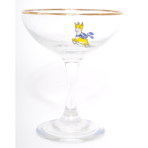 107 - An assortment of nine vintage 20th century circa. 1960's Babycham cocktail coupe glasses. Each with ... 