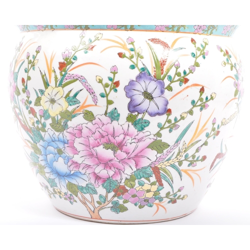 108 - An early 20th century Chinese planter. The planter having white ground with hand painted floral to b... 