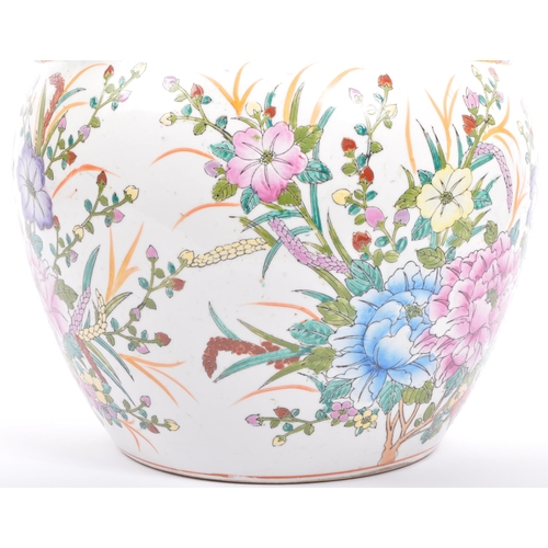 108 - An early 20th century Chinese planter. The planter having white ground with hand painted floral to b... 