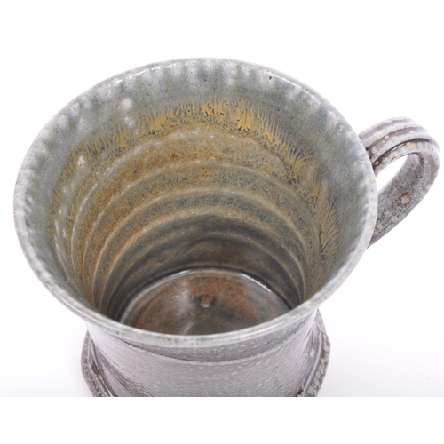 128 - Walter Keeler (b. 1945) A 20th century Walter Keeler studio pottery salt glazed earthenware mug. Pot... 