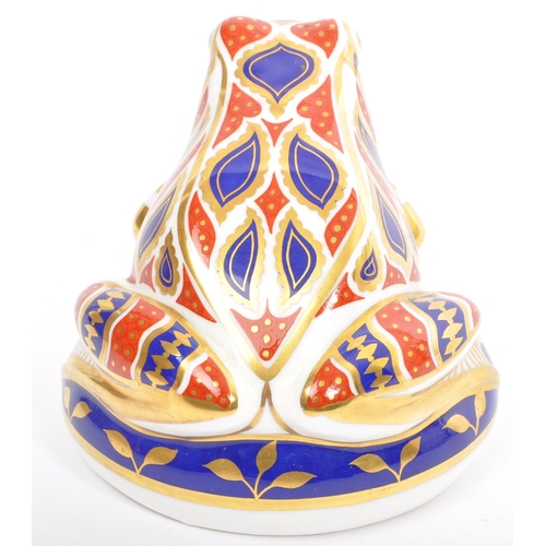 142 - A Royal Crown Derby Imari pattern toad paperweight with gold stopper.