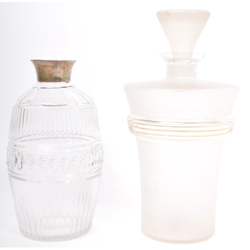 143 - A collection of 19th century and later glass decanters to include cut glass decanters alongside an e... 