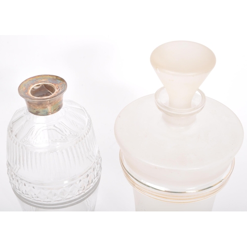 143 - A collection of 19th century and later glass decanters to include cut glass decanters alongside an e... 