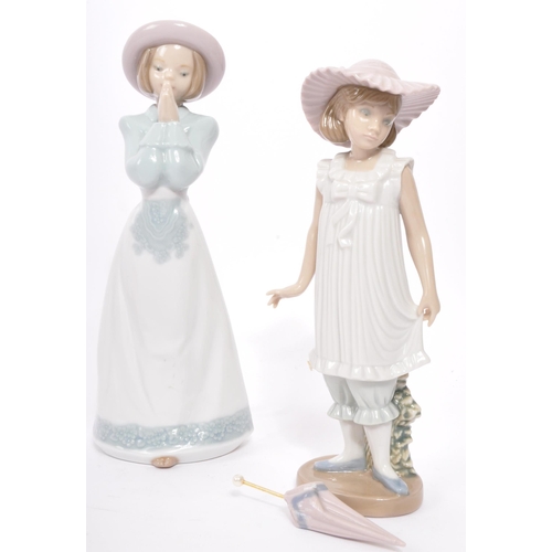 151 - A collection of four vintage 20th centuryÂ Coalport and Lladro Nao ceramic figurines to include vari... 