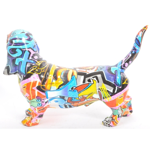 154 - A contemporary resin multicolour graffiti street art urban Basset hound sausage dog ornament figurin... 