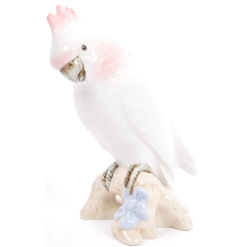 169 - Royal Dux - A 20th century Czechoslovakian porcelain figurine in the form of a cockatoo parrot by Ro... 