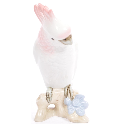 169 - Royal Dux - A 20th century Czechoslovakian porcelain figurine in the form of a cockatoo parrot by Ro... 