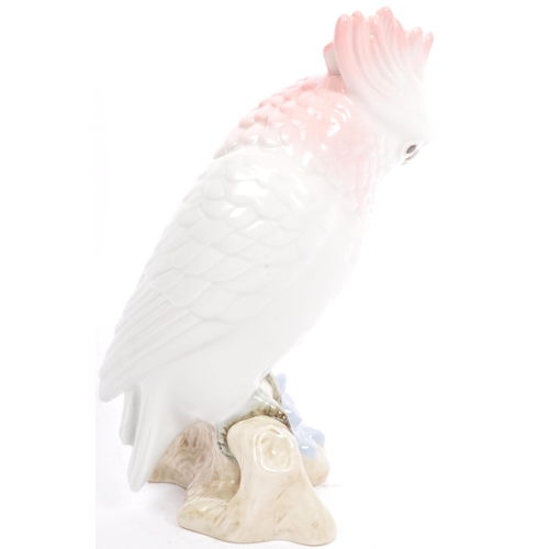 169 - Royal Dux - A 20th century Czechoslovakian porcelain figurine in the form of a cockatoo parrot by Ro... 