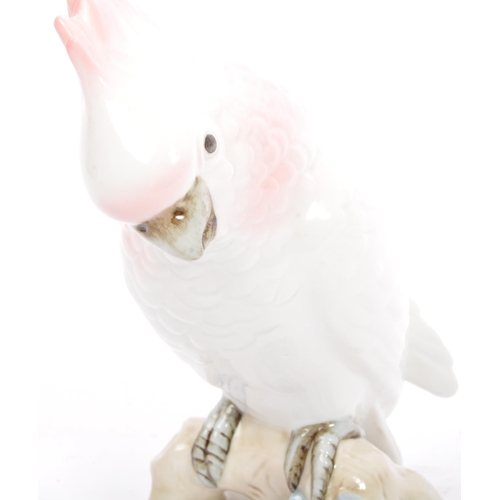 169 - Royal Dux - A 20th century Czechoslovakian porcelain figurine in the form of a cockatoo parrot by Ro... 