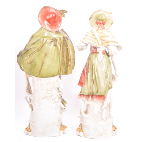 177 - A pair of early 20th century continental bisque ware figures depiciting a classical couple. With a g... 