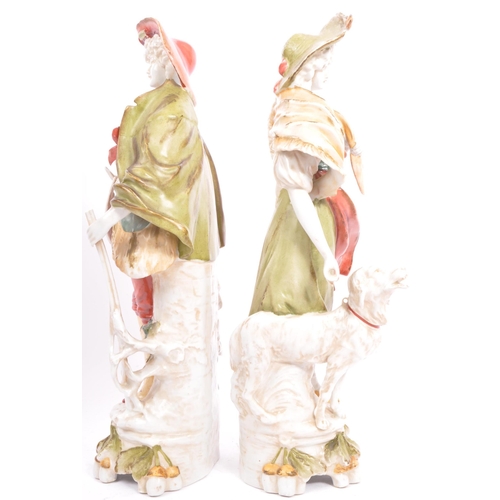 177 - A pair of early 20th century continental bisque ware figures depiciting a classical couple. With a g... 