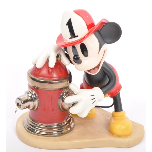 181 - Classics Walt Disney Collections - Four painted porcelain figurine / statues comprising of; Mickey M... 