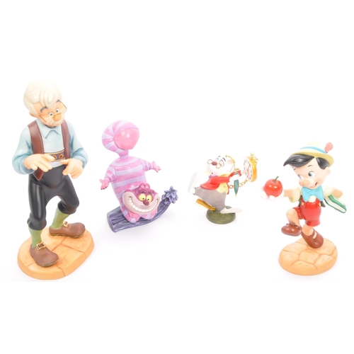 188 - Classics Walt Disney Collections - Four painted porcelain figurine / statues comprising of; Pinocchi... 