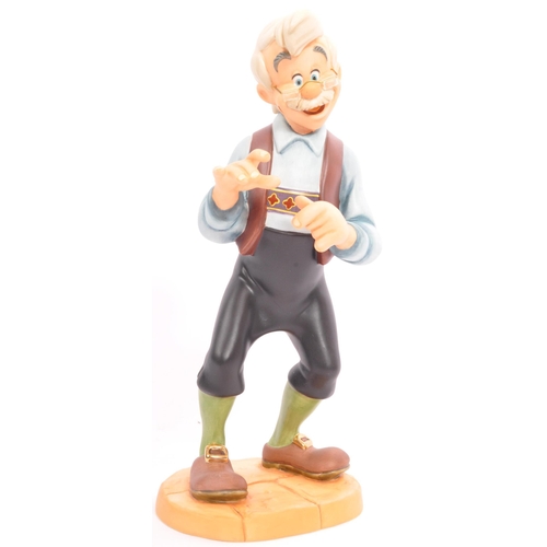 188 - Classics Walt Disney Collections - Four painted porcelain figurine / statues comprising of; Pinocchi... 