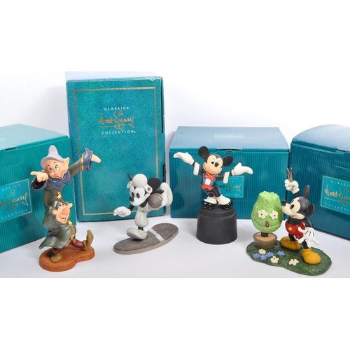 192 - Classics Walt Disney Collections - Four painted porcelain figurine / statues comprising of; Mickey M... 