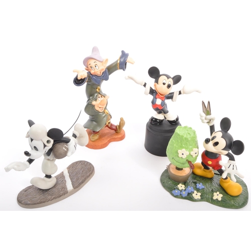 192 - Classics Walt Disney Collections - Four painted porcelain figurine / statues comprising of; Mickey M... 