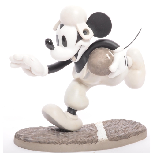 192 - Classics Walt Disney Collections - Four painted porcelain figurine / statues comprising of; Mickey M... 