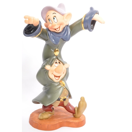 192 - Classics Walt Disney Collections - Four painted porcelain figurine / statues comprising of; Mickey M... 