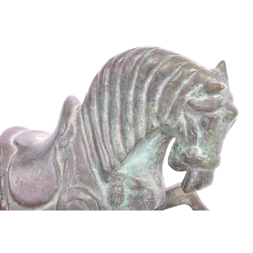 200 - A detailed 20th Century patinated effect brass figurine of a stylised horse upon a wooden plinth. Me... 