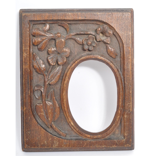 205A - A early to mid 20th century Black Forest carved wooden tray with grape and vine carving. Along with ... 