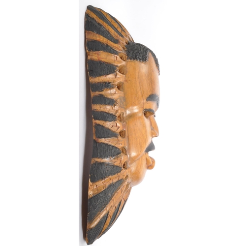 206 - A Contemporary East African Malawi wall face mask carving with detailed features with ebonised detai... 