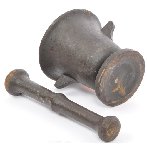 208 - An early 20th cast metal pestle and mortar having lipped rim with canted handles to each side on a c... 