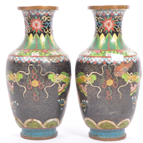 217A - A pair of early 20th century Chinese Oriental cloisonne metal table vases having a flared tall neck ... 