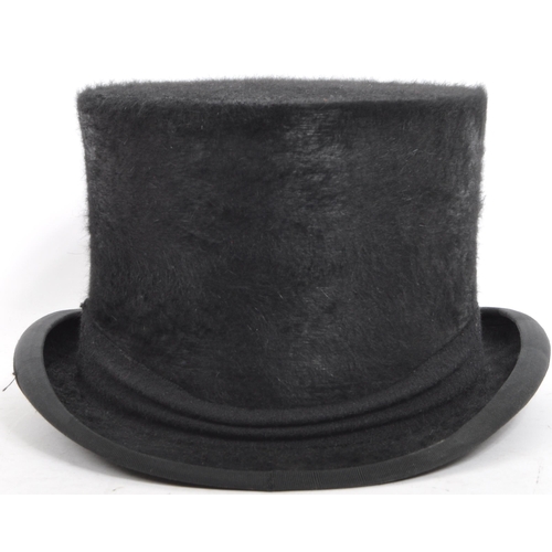 218 - A 19th / early 20th century Christys' of London silk top hat, size 7 1/2 61XL. Set within a good bro... 