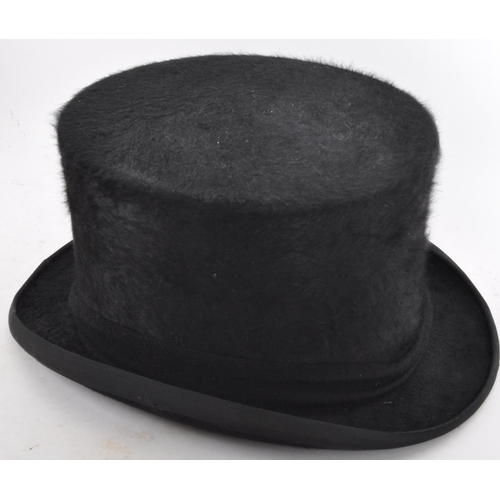 218 - A 19th / early 20th century Christys' of London silk top hat, size 7 1/2 61XL. Set within a good bro... 