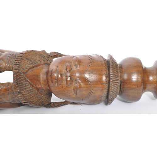 223 - A collection of 20th century African ands Asian carved hardwood figures and ornaments.