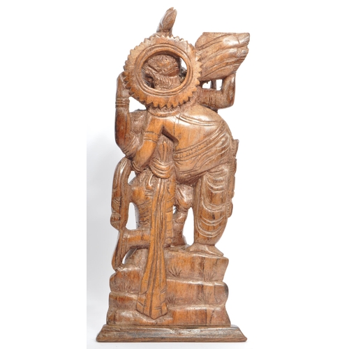 223 - A collection of 20th century African ands Asian carved hardwood figures and ornaments.