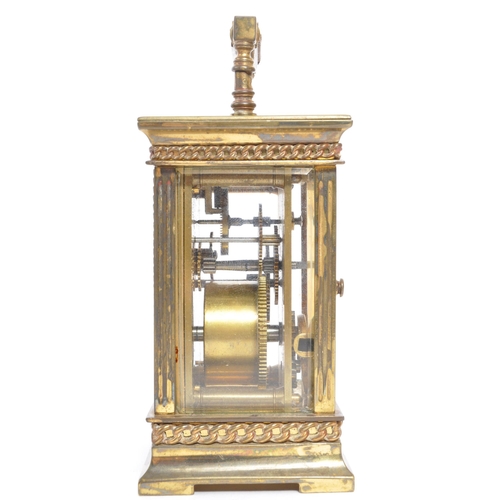 225 - A 19th century French brass gorge cased carriage clock. The clock face having Arabic numeral to chap... 