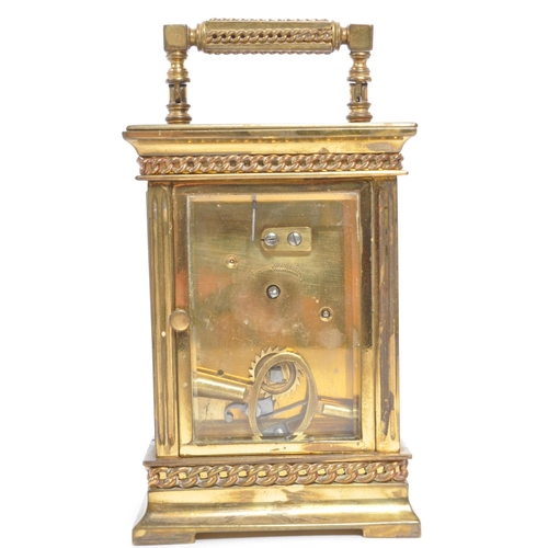 225 - A 19th century French brass gorge cased carriage clock. The clock face having Arabic numeral to chap... 