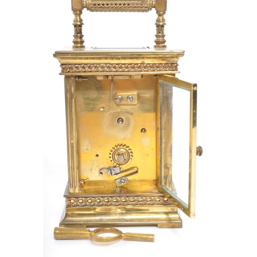 225 - A 19th century French brass gorge cased carriage clock. The clock face having Arabic numeral to chap... 