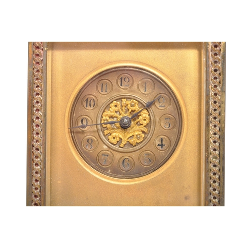 225 - A 19th century French brass gorge cased carriage clock. The clock face having Arabic numeral to chap... 