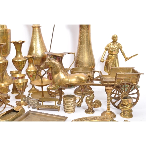 229 - A large collection of 19th century and later brass to include Anglo-Indian incised vases, an oil lam... 