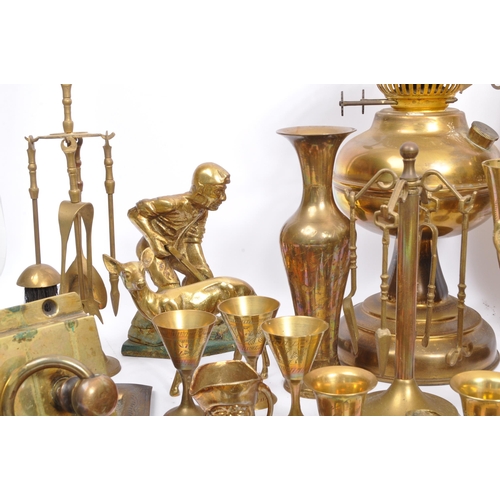 229 - A large collection of 19th century and later brass to include Anglo-Indian incised vases, an oil lam... 