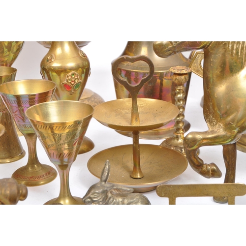 229 - A large collection of 19th century and later brass to include Anglo-Indian incised vases, an oil lam... 