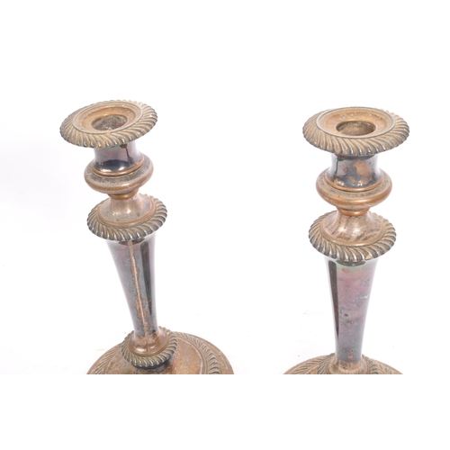 236 - A pair of 19th century silver plated - electroplate candlesticks. Eacch with circular bases, cast ma... 