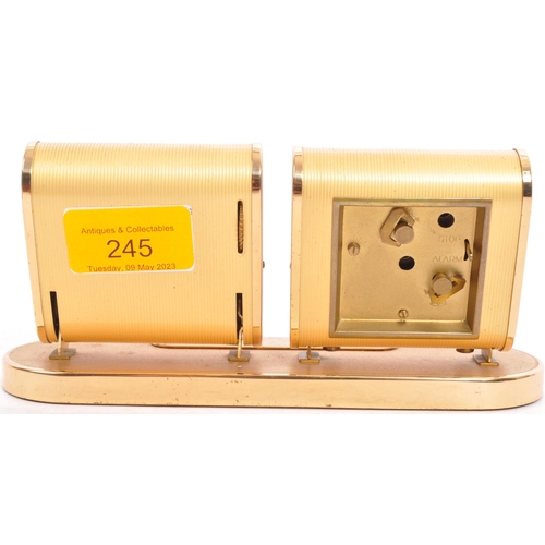 245 - Europa - A retro mid 20th Century desk clock and calendar having two separate section with brass eff... 