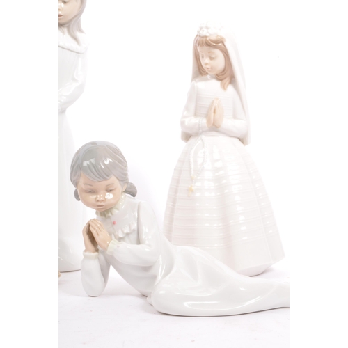 25 - Nao by Lladro - A collection of vintage 20th century Nao Spanish porcelain figurines to include Firs... 