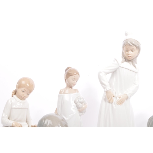 25 - Nao by Lladro - A collection of vintage 20th century Nao Spanish porcelain figurines to include Firs... 