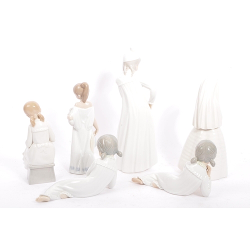 25 - Nao by Lladro - A collection of vintage 20th century Nao Spanish porcelain figurines to include Firs... 