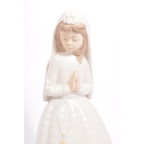 25 - Nao by Lladro - A collection of vintage 20th century Nao Spanish porcelain figurines to include Firs... 