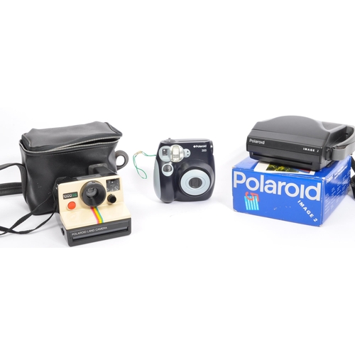 254 - A collection of vintage 20th century Polaroid camera equipment. The lot to include a Polaroid Camera... 